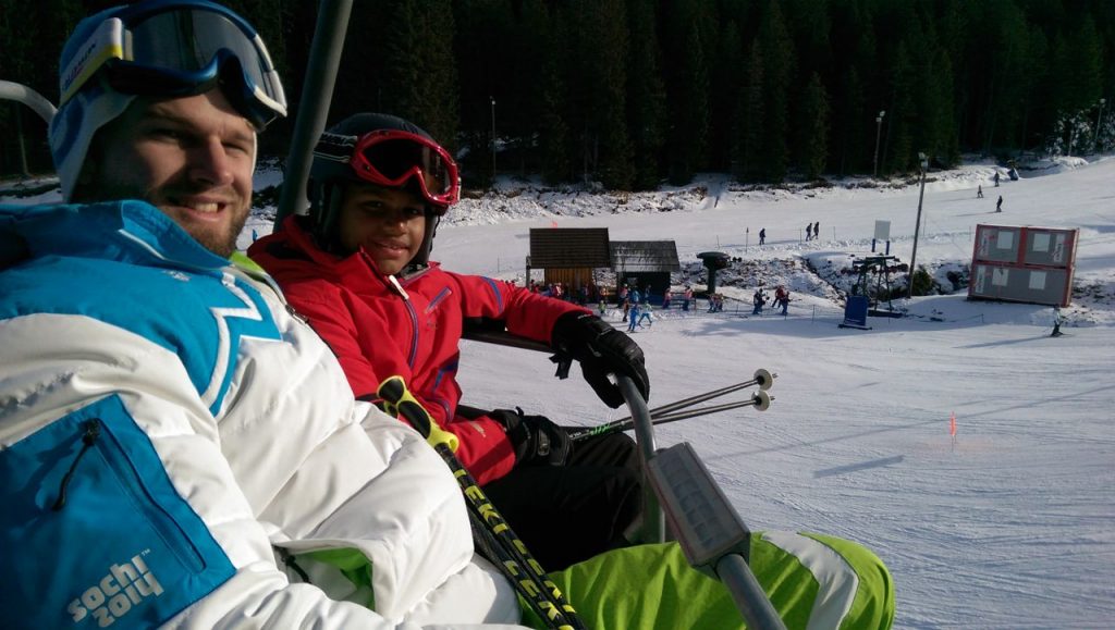 skiers on a chairlift
