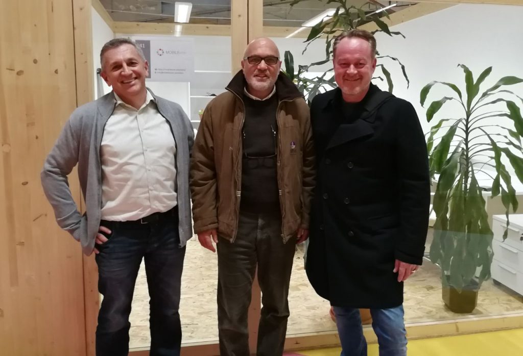 three business partners posing for a picture