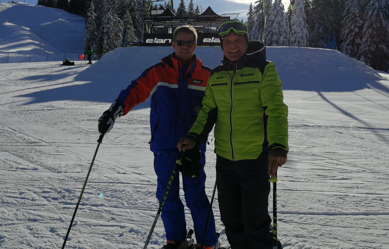 two skiers posing for a picture