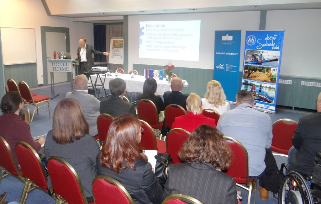 man lecturing at a conference
