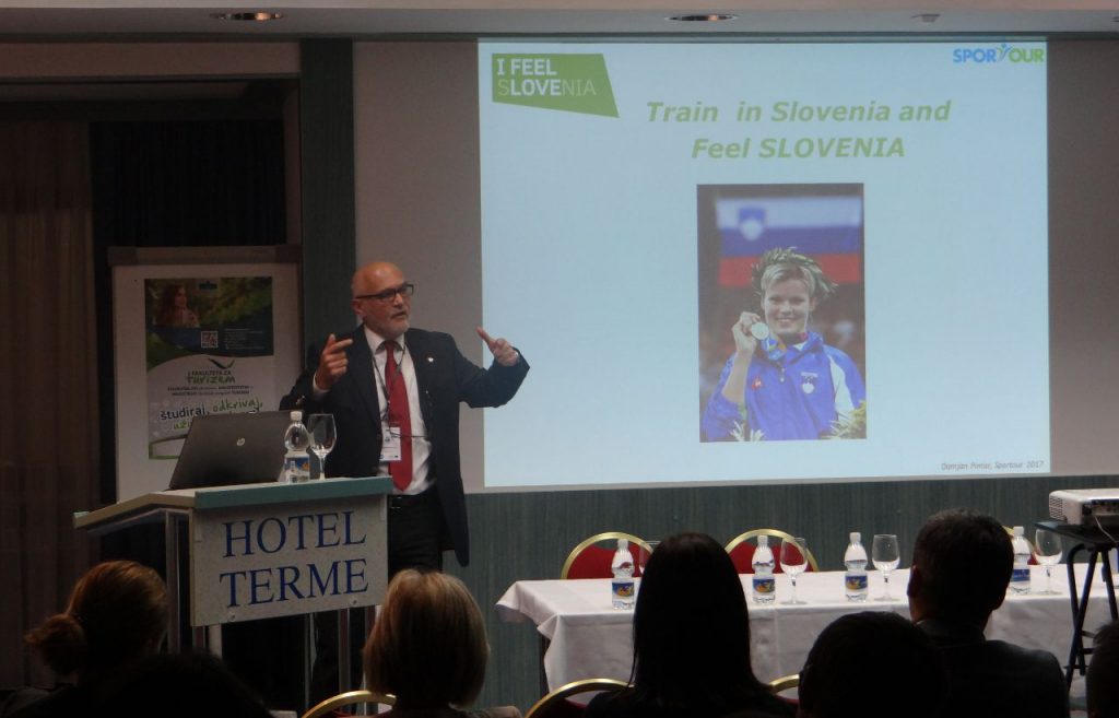 man lecturing at a conference