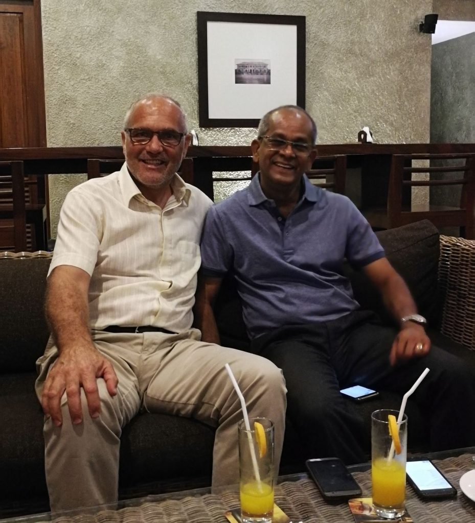 two men in an informal business meeting