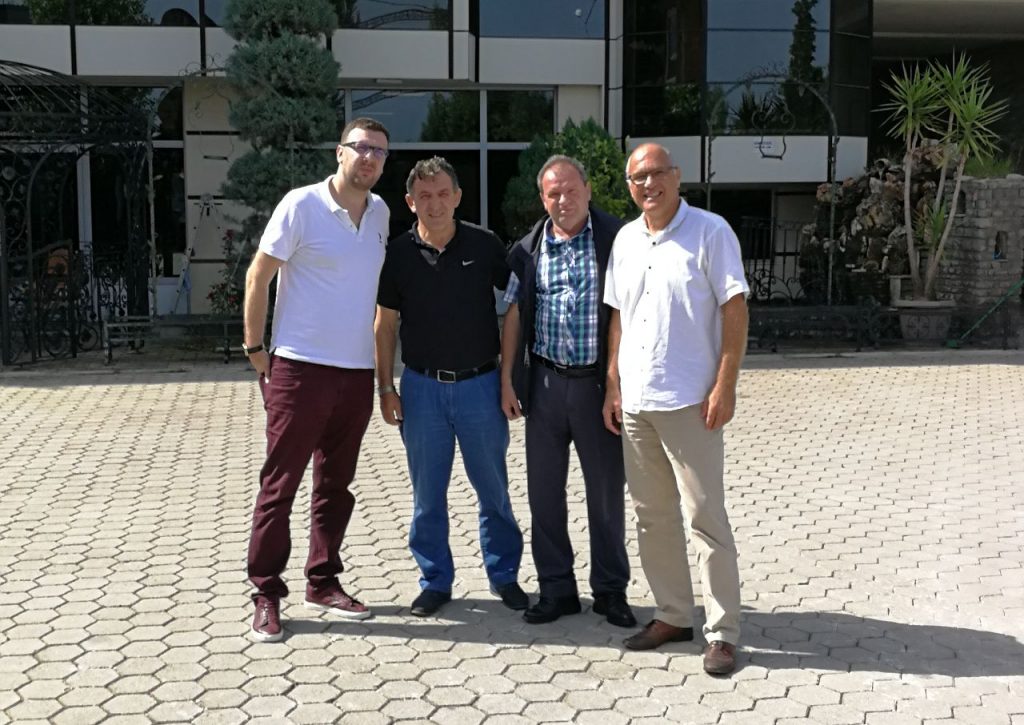 four men posing for a picture